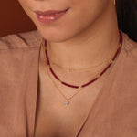 Woman wearing SHANGHAI Ruby Floral Tube Beaded Necklace with 18K Gold accents, showcasing a delicate, vibrant design.