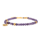 Amethyst dainty bracelet with gold spacer beads and heart charm, symbolizing love and emotional balance.