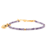 Amethyst faceted bracelet with silver bead and star charm symbolizing hope and guidance.