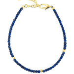 Lapis Lazuli bracelet with gold accents, featuring faceted beads and a durable clasp for elegance and style.