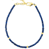Lapis Lazuli bracelet with gold accents, featuring faceted beads and a durable clasp for elegance and style.