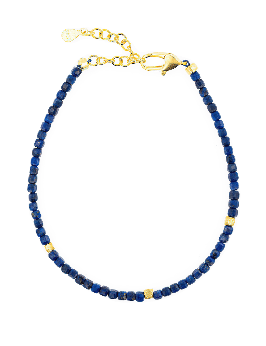 Lapis Lazuli bracelet with gold accents, featuring faceted beads and a durable clasp for elegance and style.