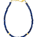Spirituality Lapis Lazuli faceted bracelet with gold clasp and spacer beads, promoting clarity and intuition.