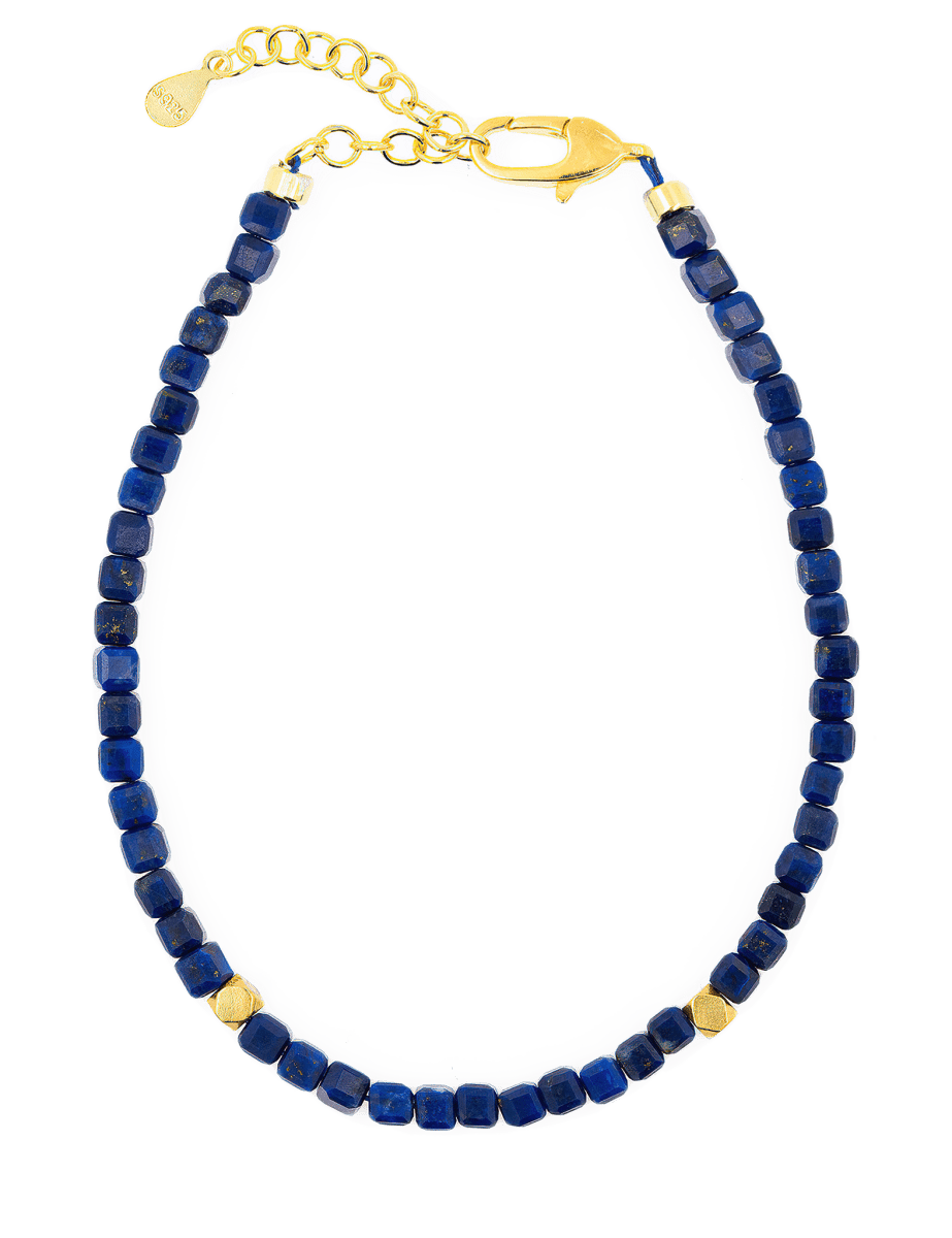 Spirituality Lapis Lazuli faceted bracelet with gold clasp and spacer beads, promoting clarity and intuition.
