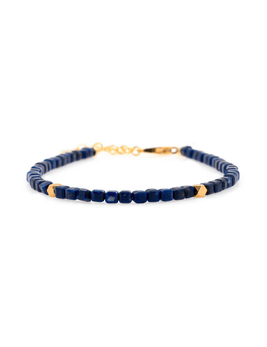 Lapis Lazuli faceted bracelet with silver spacer beads showcasing wisdom and elegance.