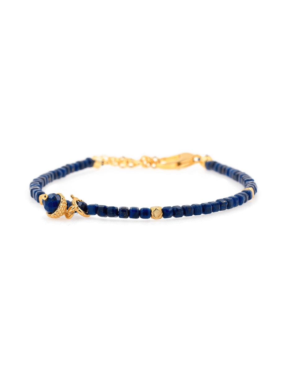 Lapis Lazuli faceted bracelet with silver spacer, charm, and beads, symbolizing wisdom and clarity.