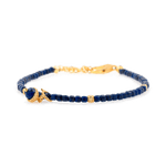 Lapis Lazuli faceted bracelet with silver spacer, charm, and beads, symbolizing wisdom and clarity.