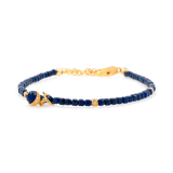 Lapis Lazuli faceted bracelet with silver spacer, charm, and beads, symbolizing wisdom and clarity.