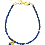 Spirituality Lapis Lazuli bracelet with gold accents and charm for inner wisdom and self-expression.