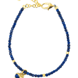 Spirituality Lapis Lazuli bracelet with gold accents and charm for inner wisdom and self-expression.