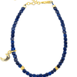 Lapis Lazuli faceted bracelet with silver spacer bead and moon charm, symbolizing intuition and transformation.