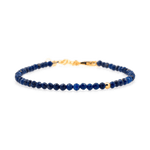 Dainty Lapis Lazuli bracelet with gold clasp, promoting wisdom and intuition, featuring glossy beads.