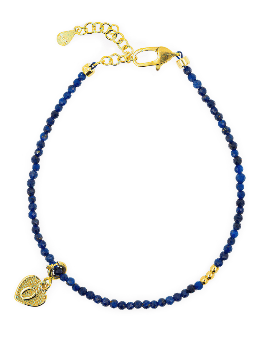 Lapis Lazuli faceted dainty bracelet with gold spacer bead and heart charm, perfect for spirituality and elegance.