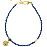 Lapis Lazuli faceted dainty bracelet with gold spacer bead and heart charm, perfect for spirituality and elegance.