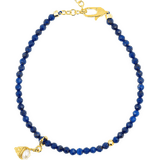 Lapis Lazuli faceted bracelet with gold clasp and pearl charm, symbolizing spirituality and playfulness.
