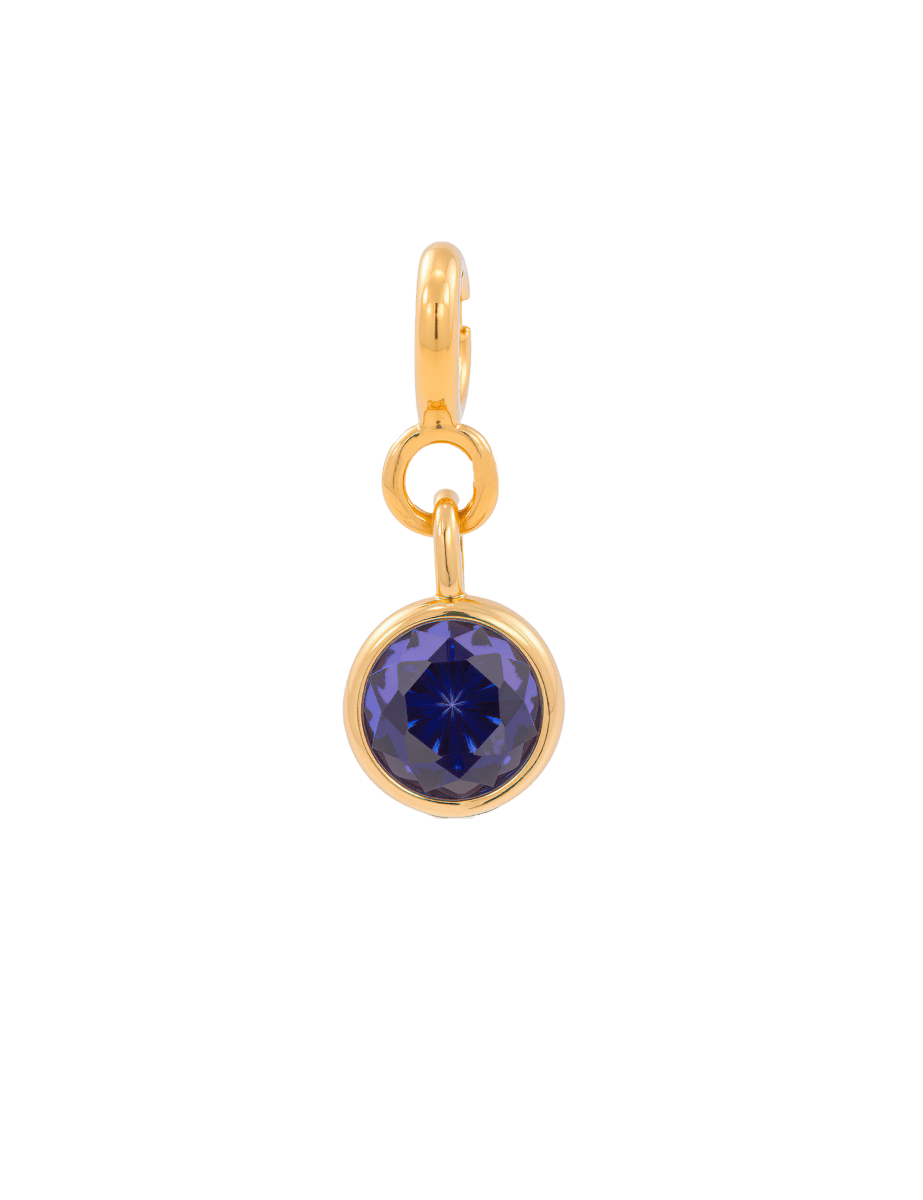 Purple zircon charm with gold setting, ideal for enhancing intuition and spiritual growth.