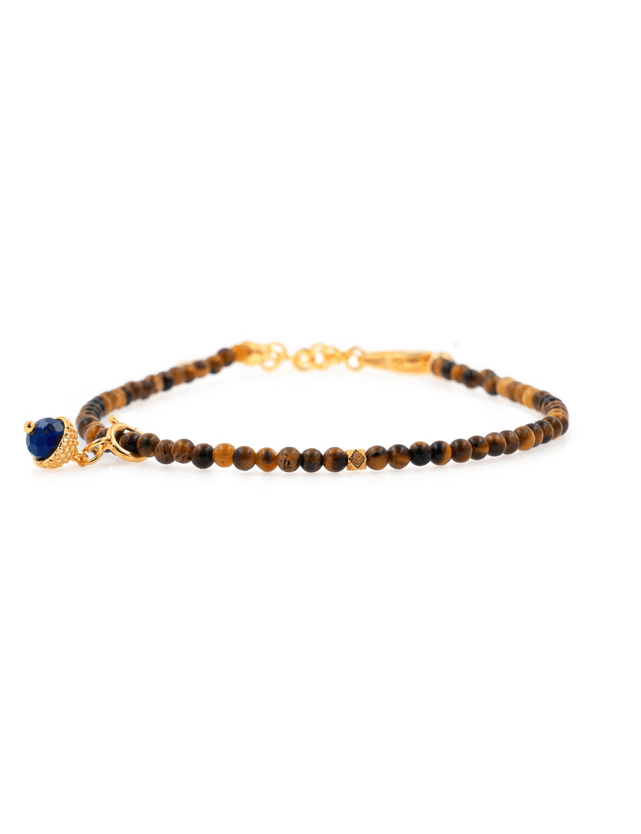 Dainty yellow Tiger's Eye bracelet with silver spacer bead and Lapis Lazuli charm, perfect for confidence and wisdom.
