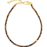 Dainty faceted Yellow Tiger’s Eye bracelet with gold clasp and spacer beads for confidence and motivation.