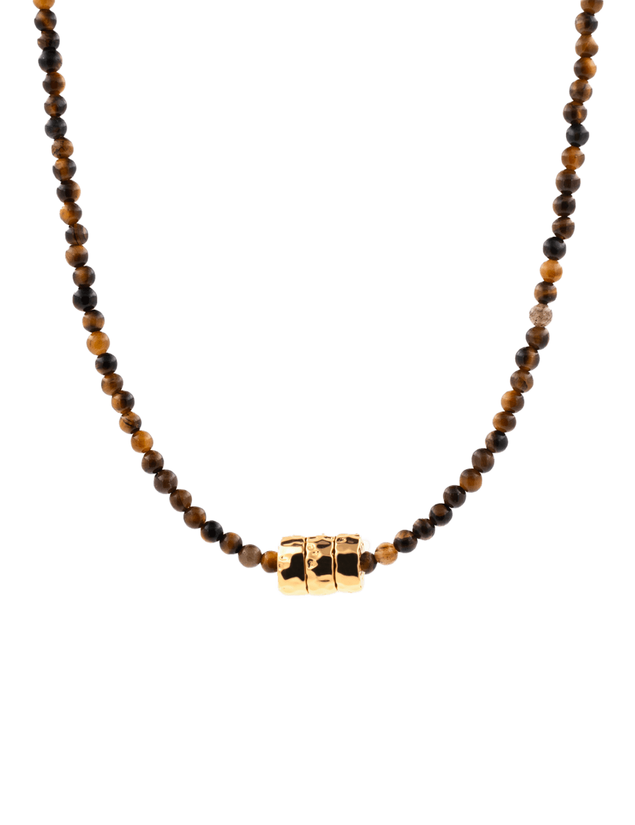 Dainty tiger's eye necklace with gold-plated nuggets, showcasing earthy tones and artisanal design.