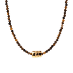 Dainty tiger's eye necklace with gold-plated nuggets, showcasing earthy tones and artisanal design.