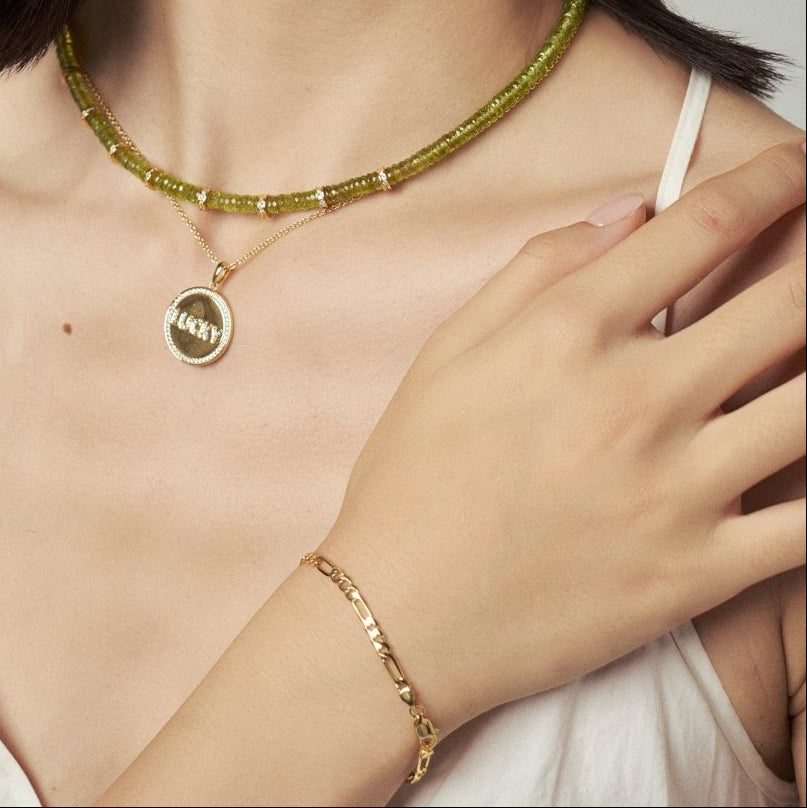 Model wearing BEAMMORE peridot gold-plated sterling silver necklace – Minimal, layer-ready, skin-friendly style
