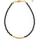 Black Tourmaline bracelet with gold spacer beads, promoting grounding and emotional balance.