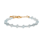 Dainty aquamarine faceted bracelet with gold clasp, symbolizing clarity and emotional balance.