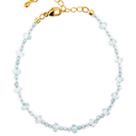 Dainty aquamarine bracelet with gold clasp, embodying clarity and emotional balance for modern lifestyles.