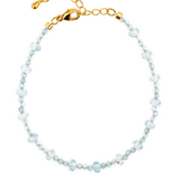 Dainty aquamarine bracelet with gold clasp, embodying clarity and emotional balance for modern lifestyles.