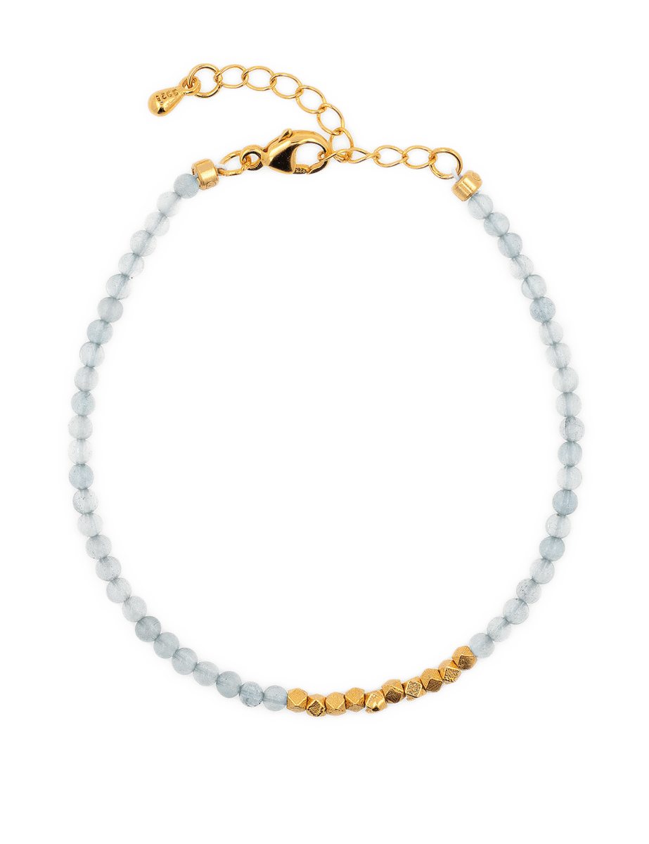 Dainty aquamarine bracelet with silver spacer beads, reflecting modern minimalist design and water element energy.