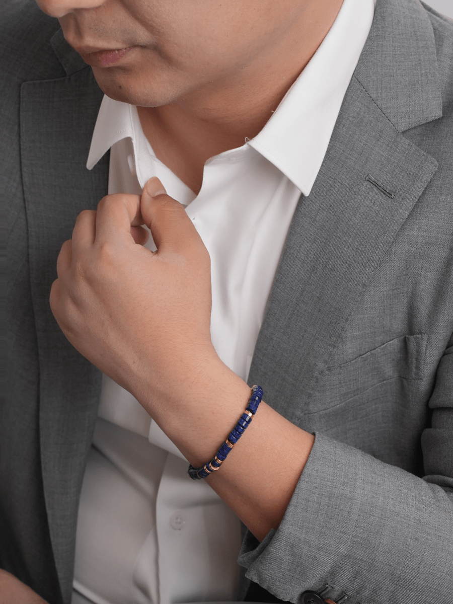 Man wearing a Lapis Lazuli and gold-plated sterling silver bracelet, enhancing style and elegance.